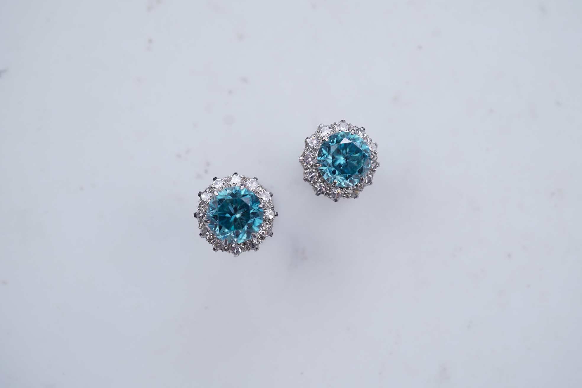A pair of zircon and diamond earrings, mid 20th century
